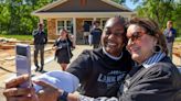 Built by 'Bama: Nick and Terry Saban help build 21st Habitat house