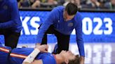 College basketball player stretchered off court with broken leg