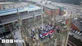 School choir sings on top of Hull Minster tower