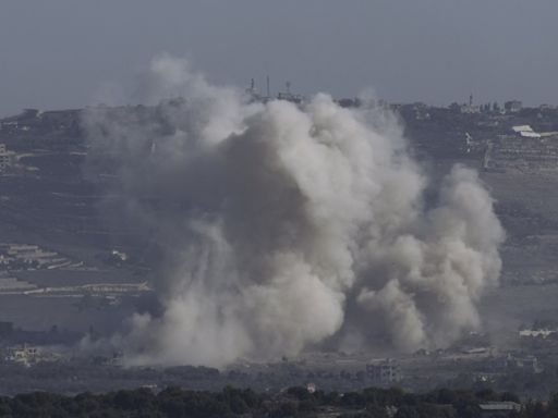 Middle East latest: An Israeli airstrike cuts a major highway linking Lebanon with Syria