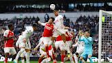 Arsenal hang on to beat Spurs, stretch lead at top