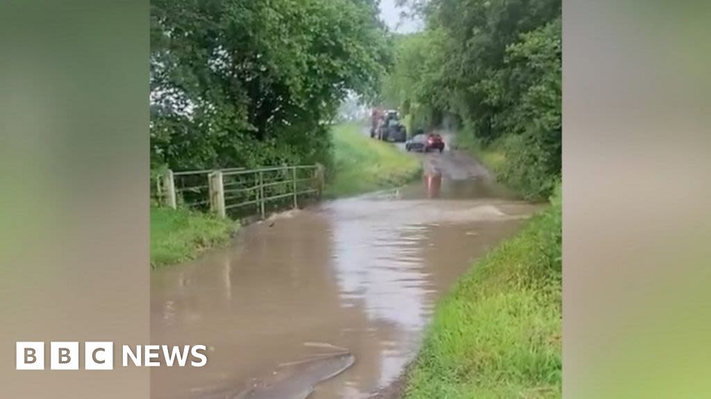 Heavy rain causes high water at ford in Holme Hale, Norfolk