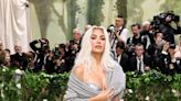 Kim Kardashian Pairs a Metallic ﻿Maison Margiela Corset With a Cozy Cardigan at the Met Gala﻿