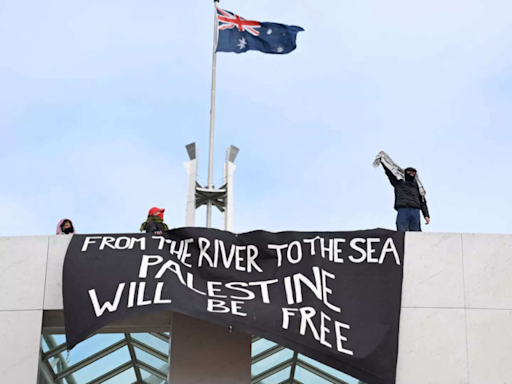 Pro-Palestine supporters climb roof of Australia’s Parliament House - Times of India