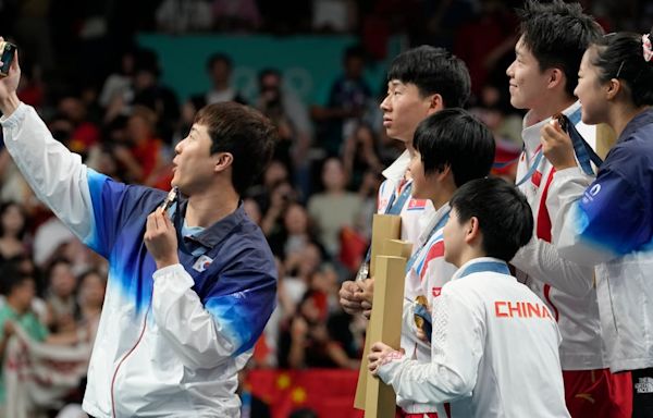 North and South Korea celebrate with selfies during the medal ceremony at the Paris Olympics