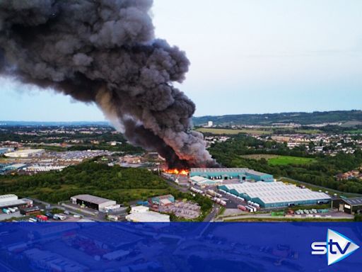 Massive plume of smoke after 'large-scale' fire erupts at industrial estate