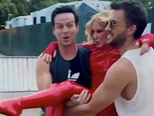 Kylie Minogue carried to BST stage in latex outfit by Andrew Scott and Jonathan Bailey