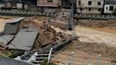 Shocking pics show bridges collapsing as floods threaten 127million in China