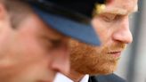 Emotional Prince Harry puffs out his cheeks as he gets into car with Meghan after Queen’s funeral