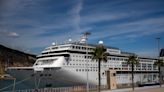 A cruise ship stuck in Barcelona resumes sailing after passengers accused of having fake visas were removed and investigated by authorities