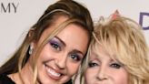 Miley Cyrus Poses with Godmother Dolly Parton in BTS Snap from a Special Holiday Project