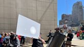 Milwaukee residents watch the partial solar eclipse at Public Museum, UW-Milwaukee