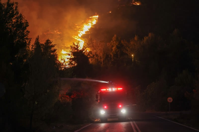 Greek wildfire spreads to edge of Athens; towns, hospitals evacuated