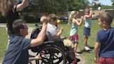 Students help bring joy, laughter to wheelchair-bound classmate as they get passing drivers to honk