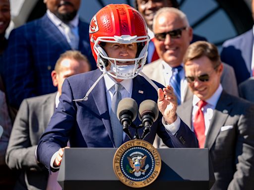President Biden dons Chiefs helmet, jokes with Travis Kelce in Super Bowl champs' second White House visit
