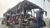 A double-decker bus collides with a milk truck in northern India, killing at least 18 people