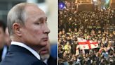 Putin watches on as Eastern European nation passes law favoring Moscow amid violent protests