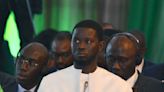 Senegal’s leader wasn't born when ECOWAS was founded. He's asked to reunite the bloc split by coups