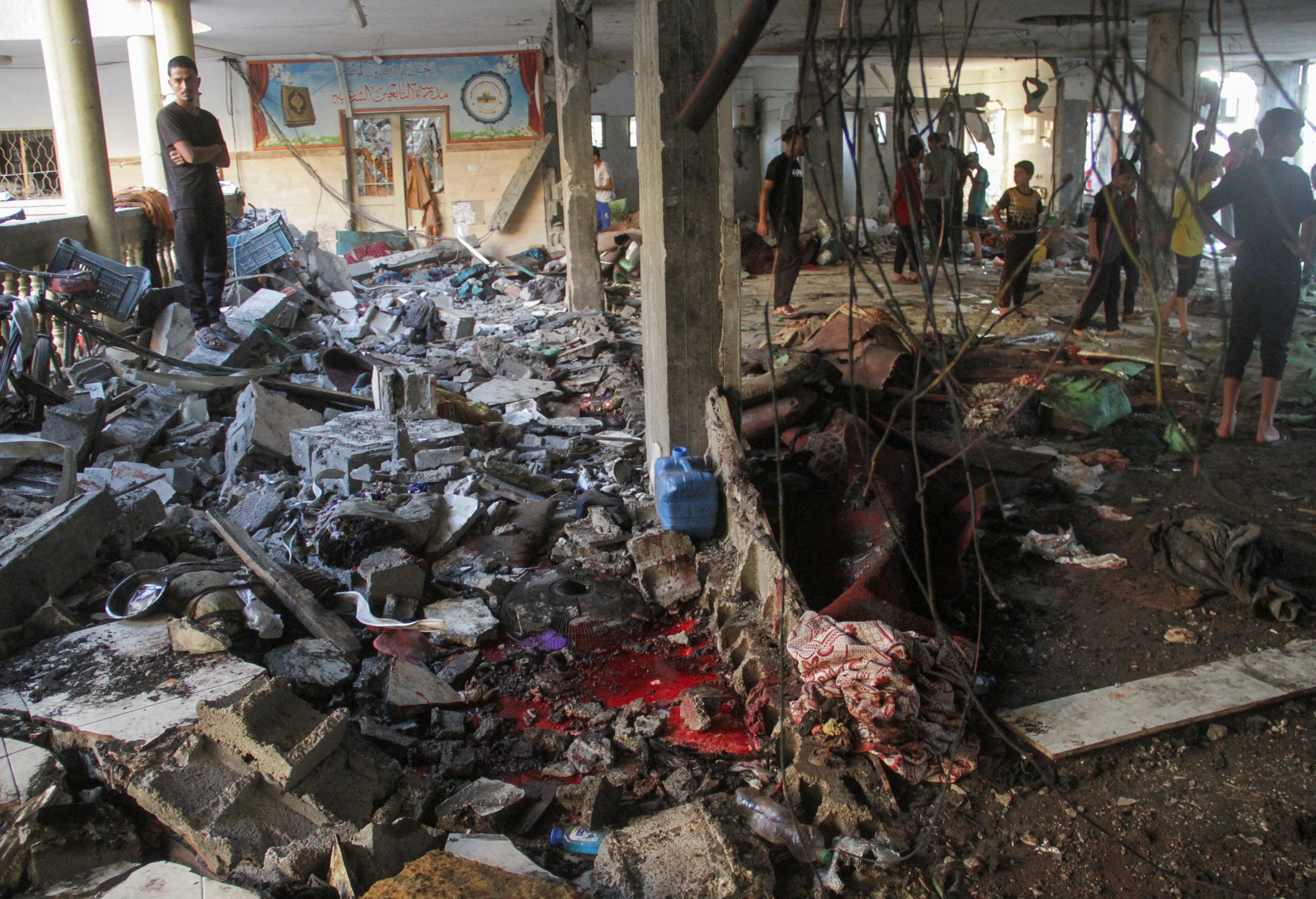 Scores reported dead in Gaza school shelter as Israel says it bombed militants