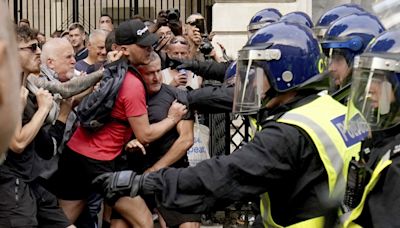 Mob clashes with UK police in protests over killing of three girls