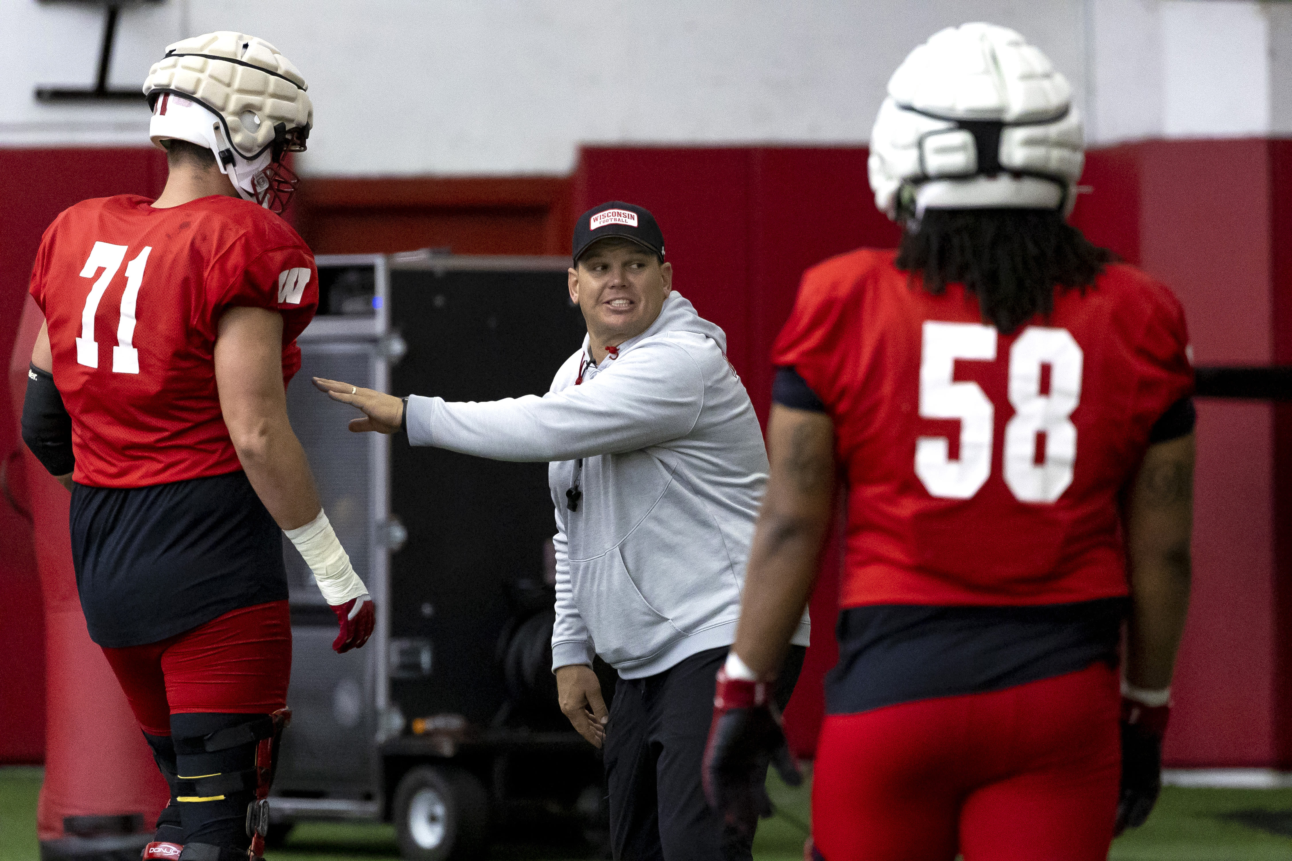 Wisconsin tries to regain supremacy in the trenches under its 4th O-line coach in as many years