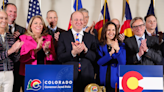 Polis signs Colorado budget, touts funding for schools and affordable housing