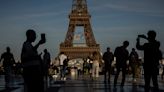 AP Sports Week in Pictures: Olympic rings on the Eiffel Tower and diving amid skyscrapers in Boston