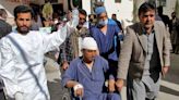 Blasts near Pakistan candidates' offices kill 26 on eve of election