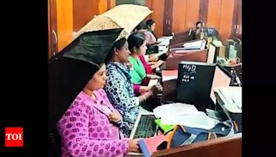 Umbrellas to rescue at leaky Haveri govt office in Karnataka | Bengaluru News - Times of India