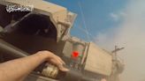 Video seems to show Hamas fighter running up to an Israeli tank, planting an explosive on it, then shooting it