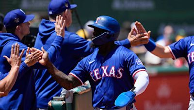 Texas Rangers score 10 runs in second inning, beat Oakland Athletics 15-8