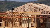 US single-family housing starts hit eight-month low; green shoots in manufacturing