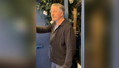 Alec Baldwin smacks phone of anti-Israel agitator who begged him to say 'Free Palestine' inside coffee shop