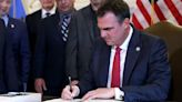 Gov. Stitt signs Texas-style immigration bill into law