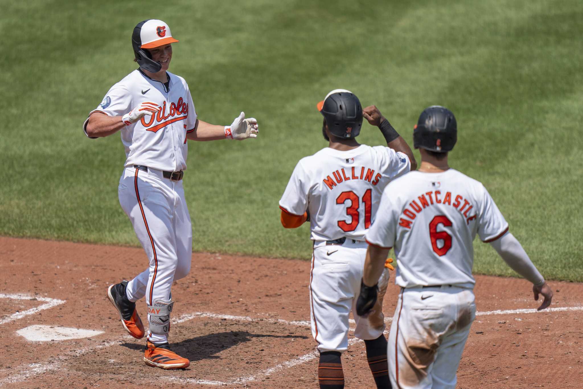 Jackson Holliday's grand slam lifts the Orioles to a 10-4 victory over the Blue Jays