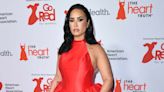 Demi Lovato Goes from Dramatic Gown to Rocking Red Suit for AHA Red Dress Concert Performance