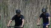 Hunter Biden (R) rides bikes with his father, US President Joe Biden, in Rehoboth Beach, Delaware two days before the son goes on trial on felony gun charges