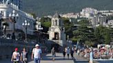 Russian tourism in Crimea is down, but many still shrug off risks