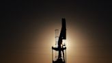 Oil prices fall, dogged by rise in crude, gasoline stocks