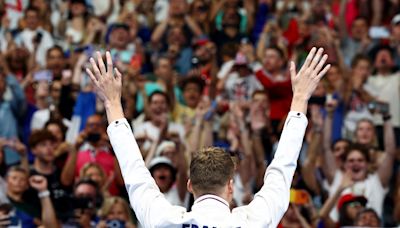 Leon Marchand lands gold, an Olympic record and France’s collective heart