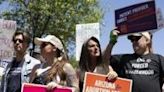 Arizona governor signs bill repealing 1864 abortion ban