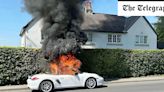 Porsche driver leaps out of car as convertible bursts into flames