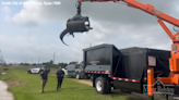 ‘See ya later, alligator!’: Grapple truck lifts 12-foot alligator from ditch