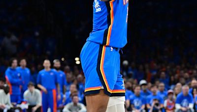 The Oklahoma City Thunder's Shai Gilgeous-Alexander attempts a 3- point basket against the Dallas Mavericks during the third quarter in Game 2 of the Western Conference...