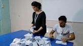 Tunisian officials say new constitution passed in vote with low turnout
