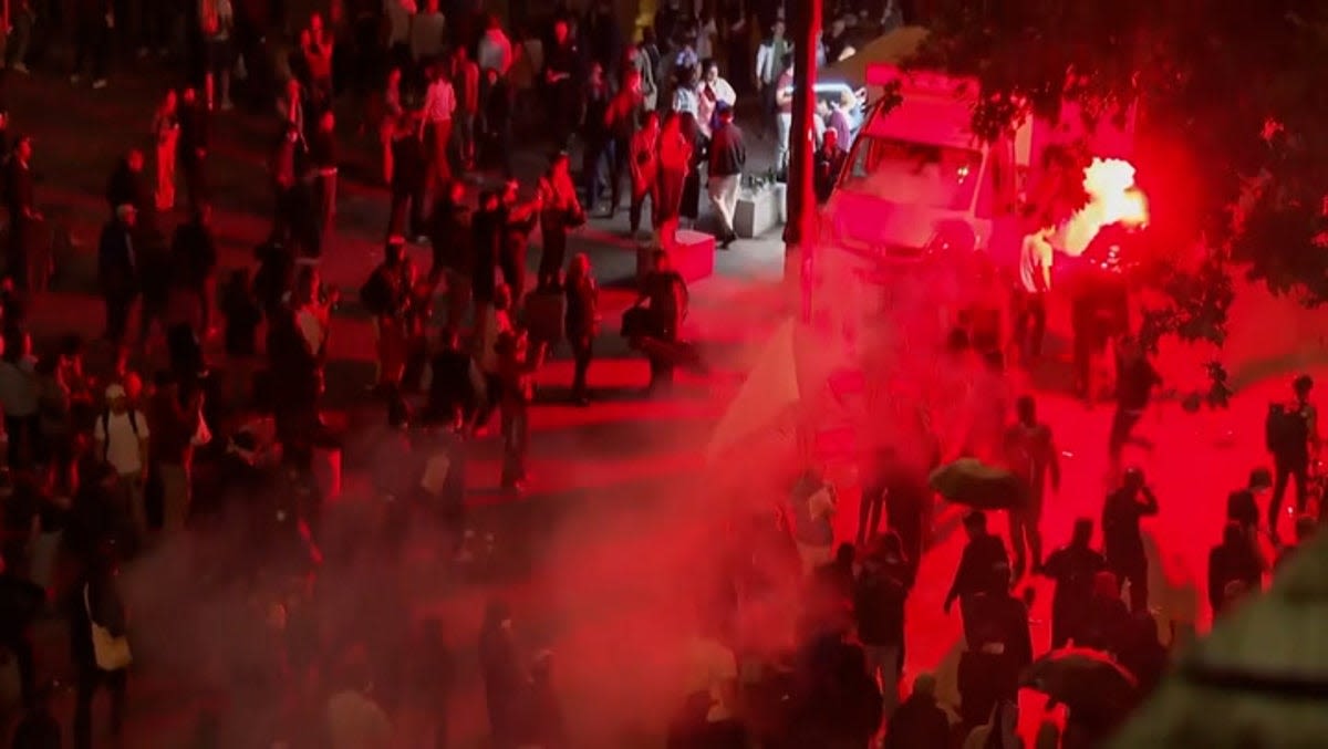 Tear gas and riot police deployed against crowds gathering at Paris landmark after French election results