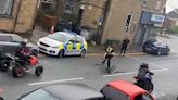 Dramatic moment police officer is struck by a quad bike