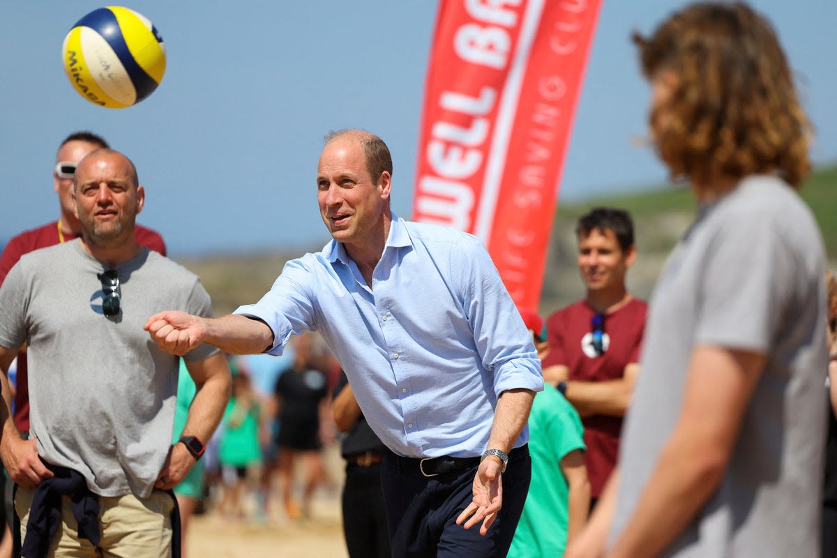 Prince William joins in volleyball game with children on Cornwall beach