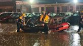 Rescue crews save woman trapped inside her vehicle in flood waters along Saw Mill Run Boulevard