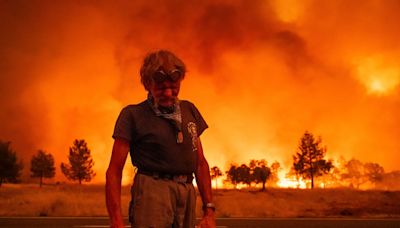 California firefighters, helped by cooler weather, battle blaze larger than Los Angeles